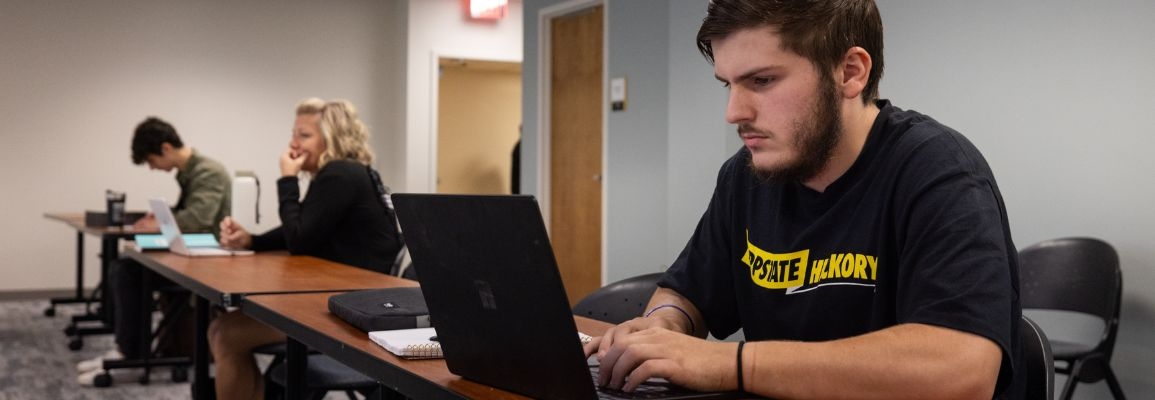 A student on their laptop at App State Hickory.